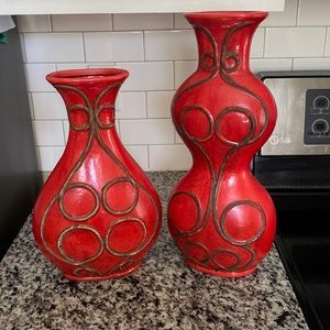 Two Matching Decorative Red Vases